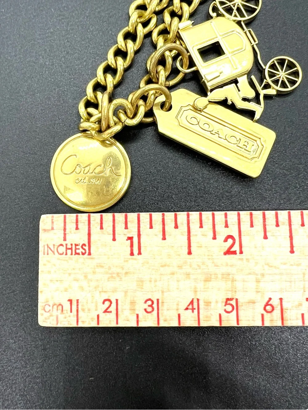 Coach Gold Tone Charm Bracelet with Carriage Charms